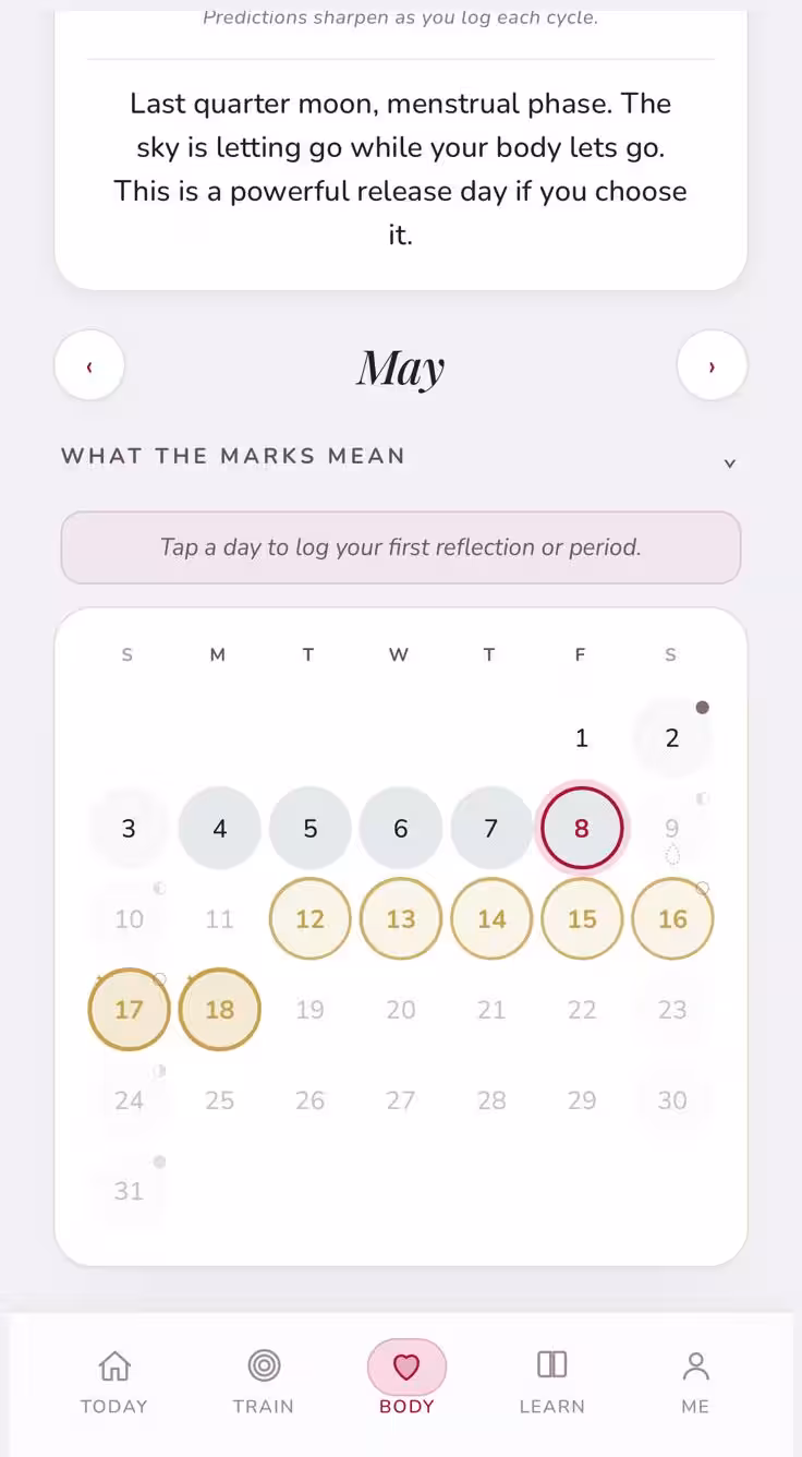 Be Bold app calendar showing the month with menstrual phase, fertile window, and moon phases