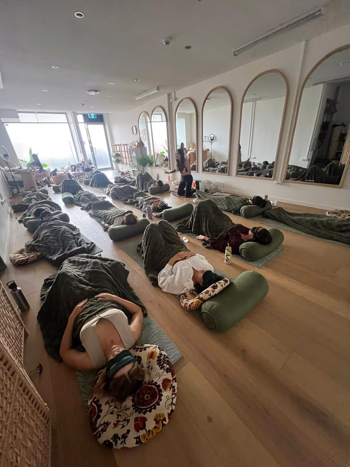 Women in breathwork and relaxation during Be Bold workshop